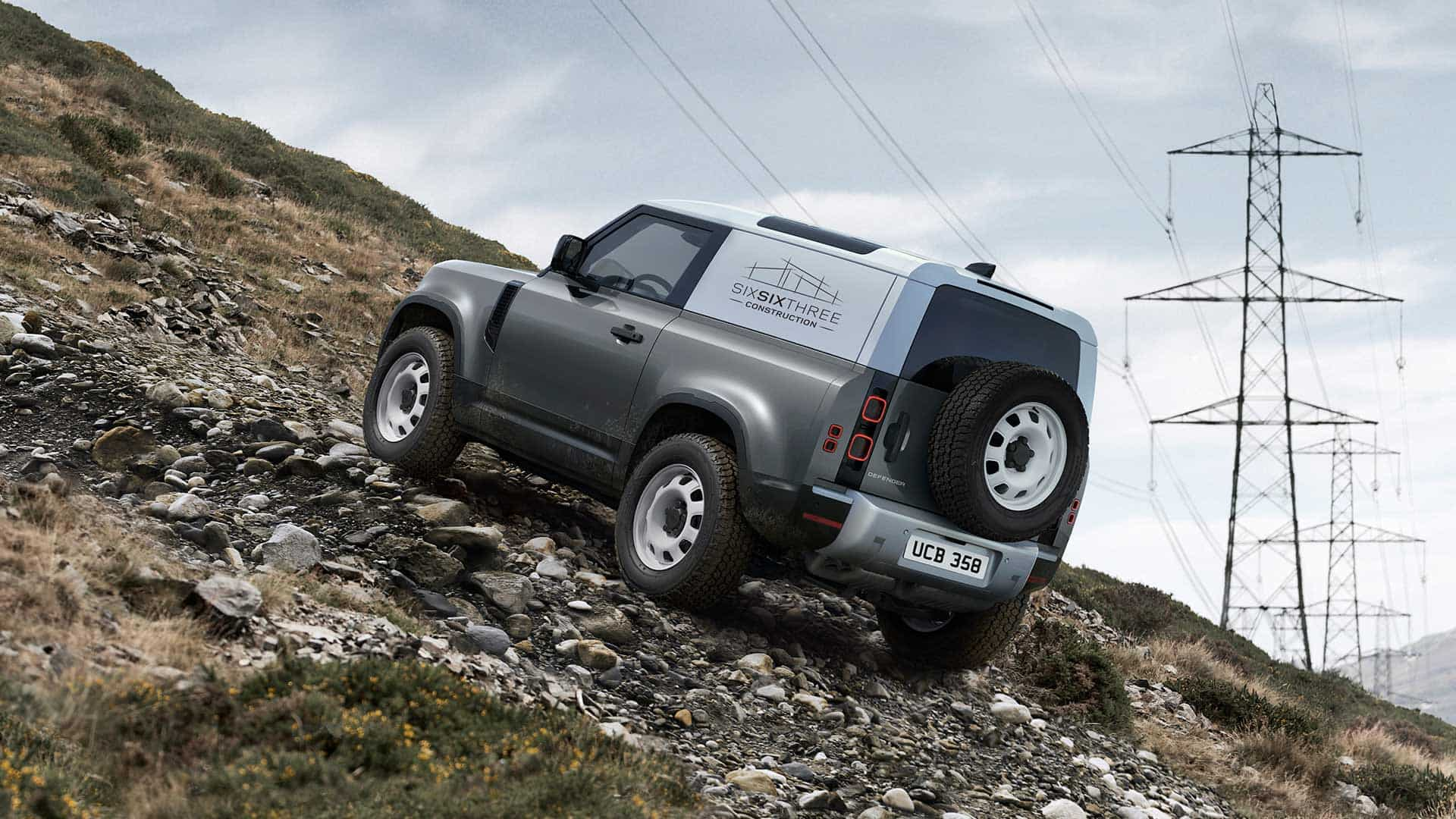 Defender climbing on mountain