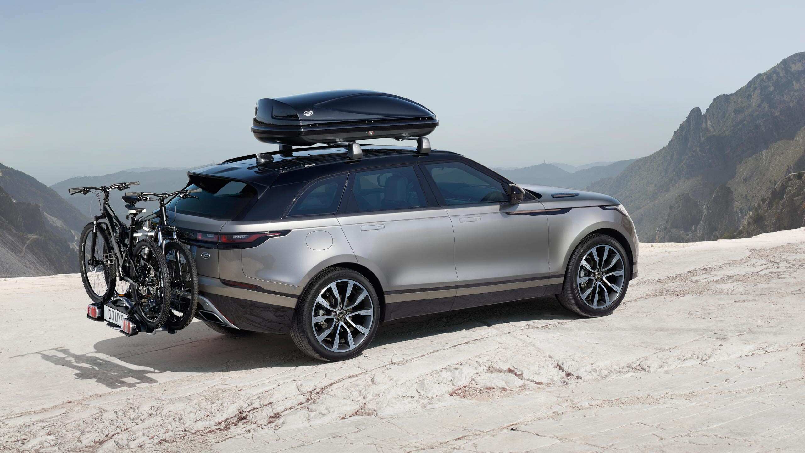 Range Rover Velar driving through mountains