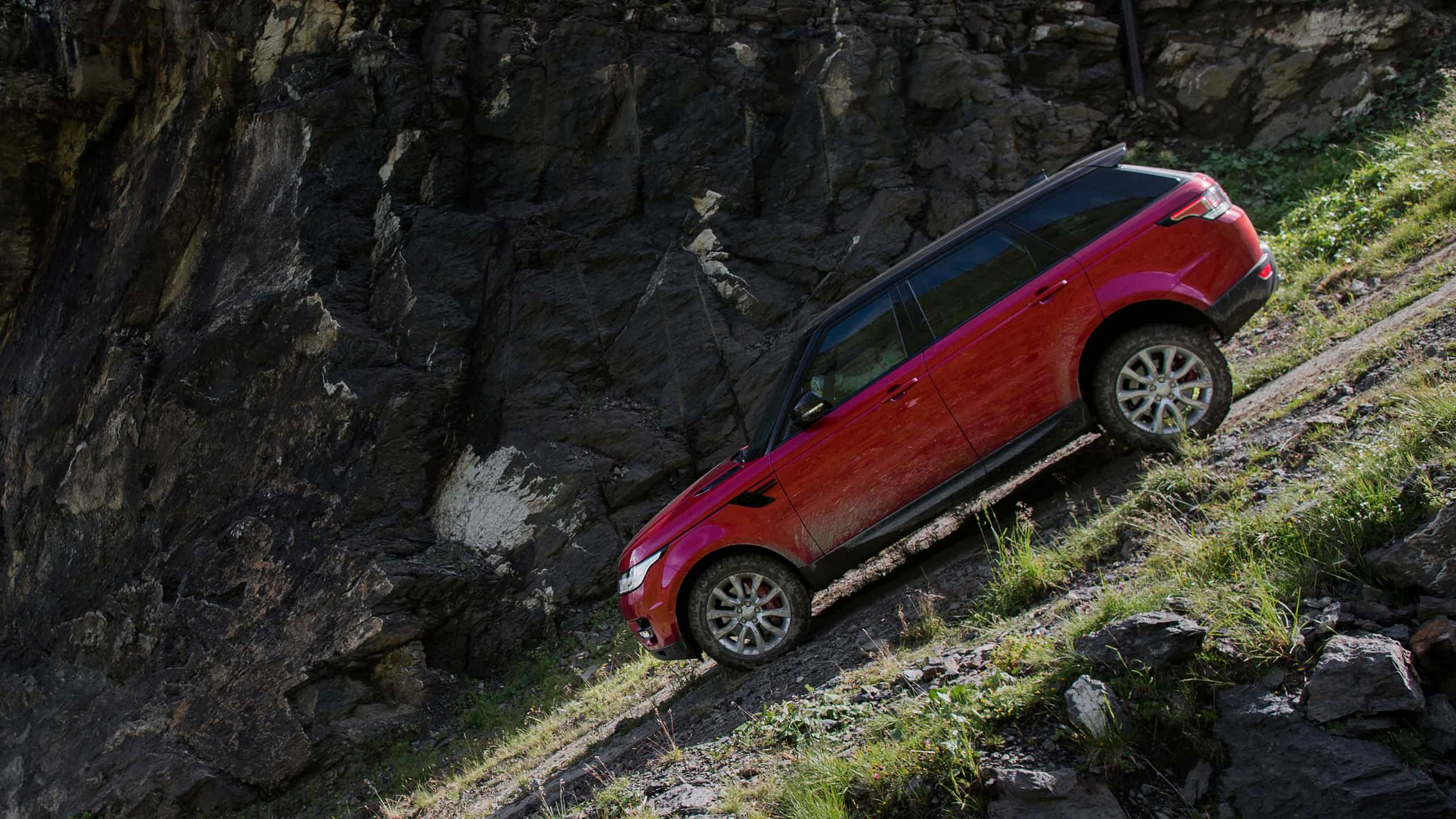 Range Rover Sport moving down on Hilly Mountain Road