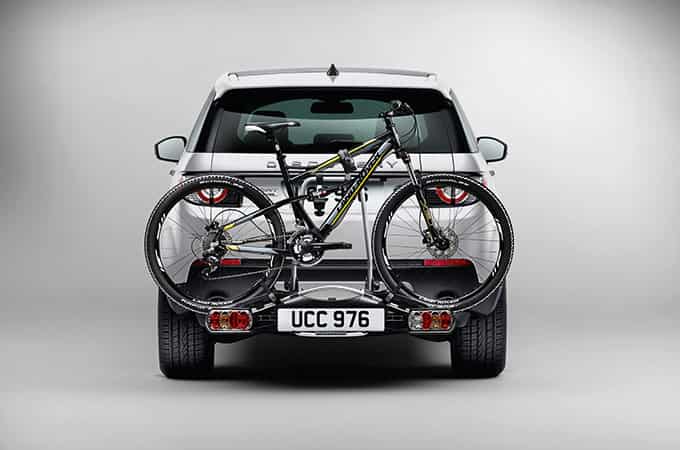 Range Rover with bike behind car
