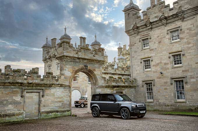 Range Rover driving through castle