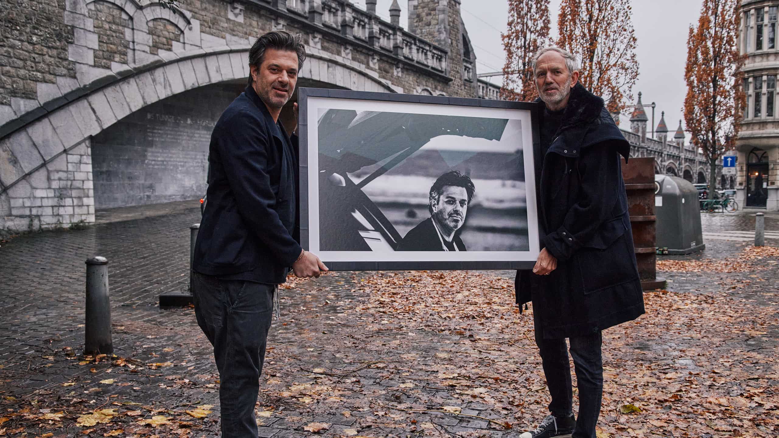 Two men displaying photo portrait
